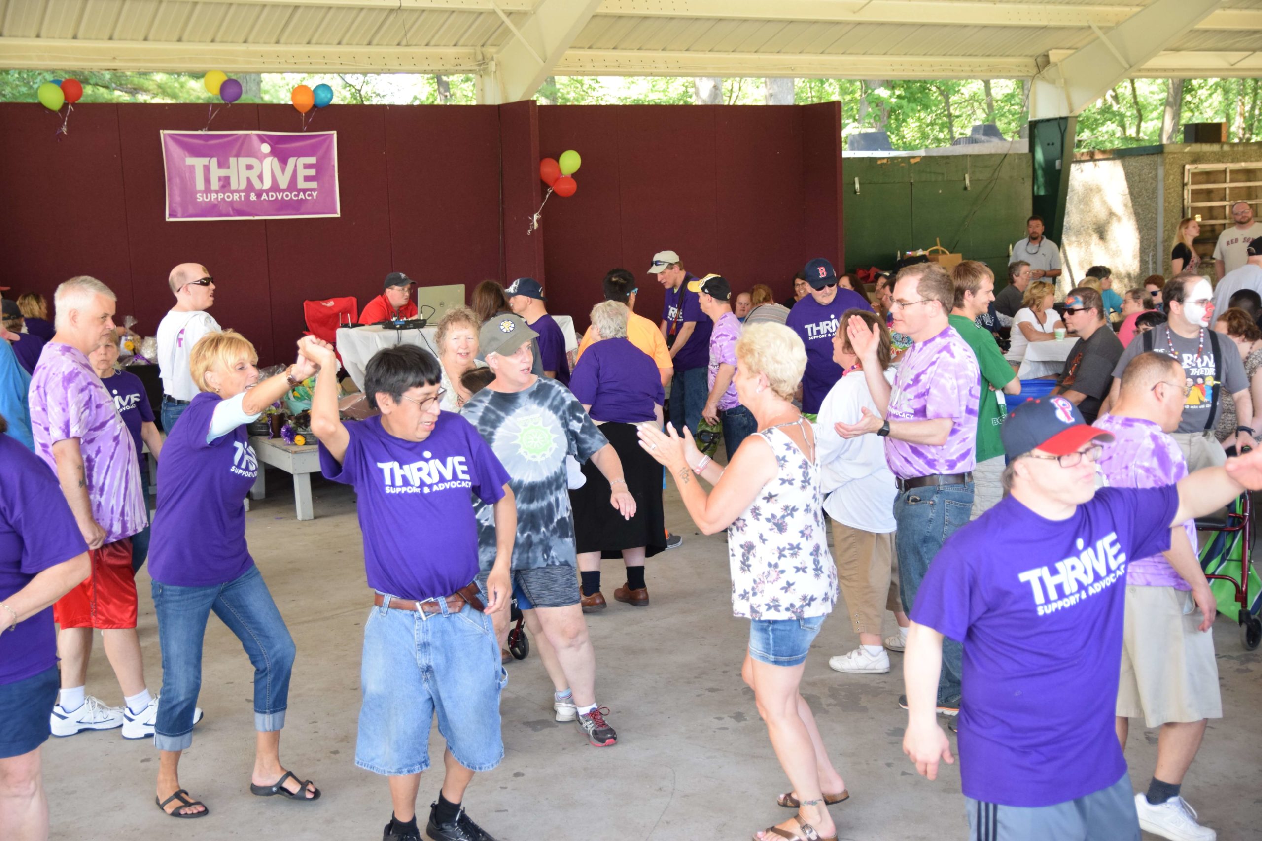 Thrive participants dancing at summer Funfest