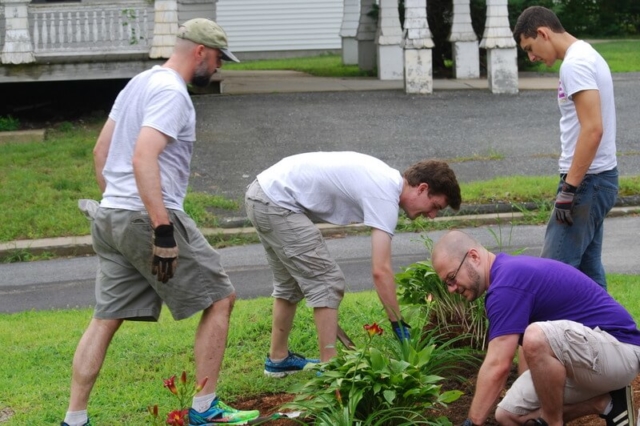 Volunteers garden at a Thrive residence