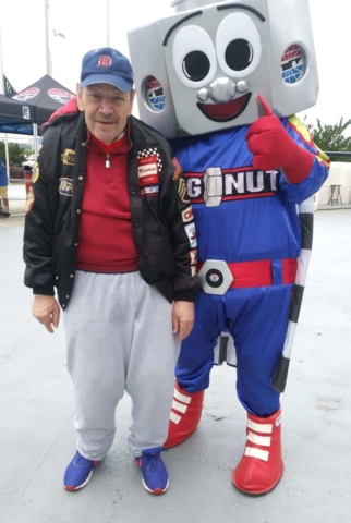 Thrive participants at race track with mascot