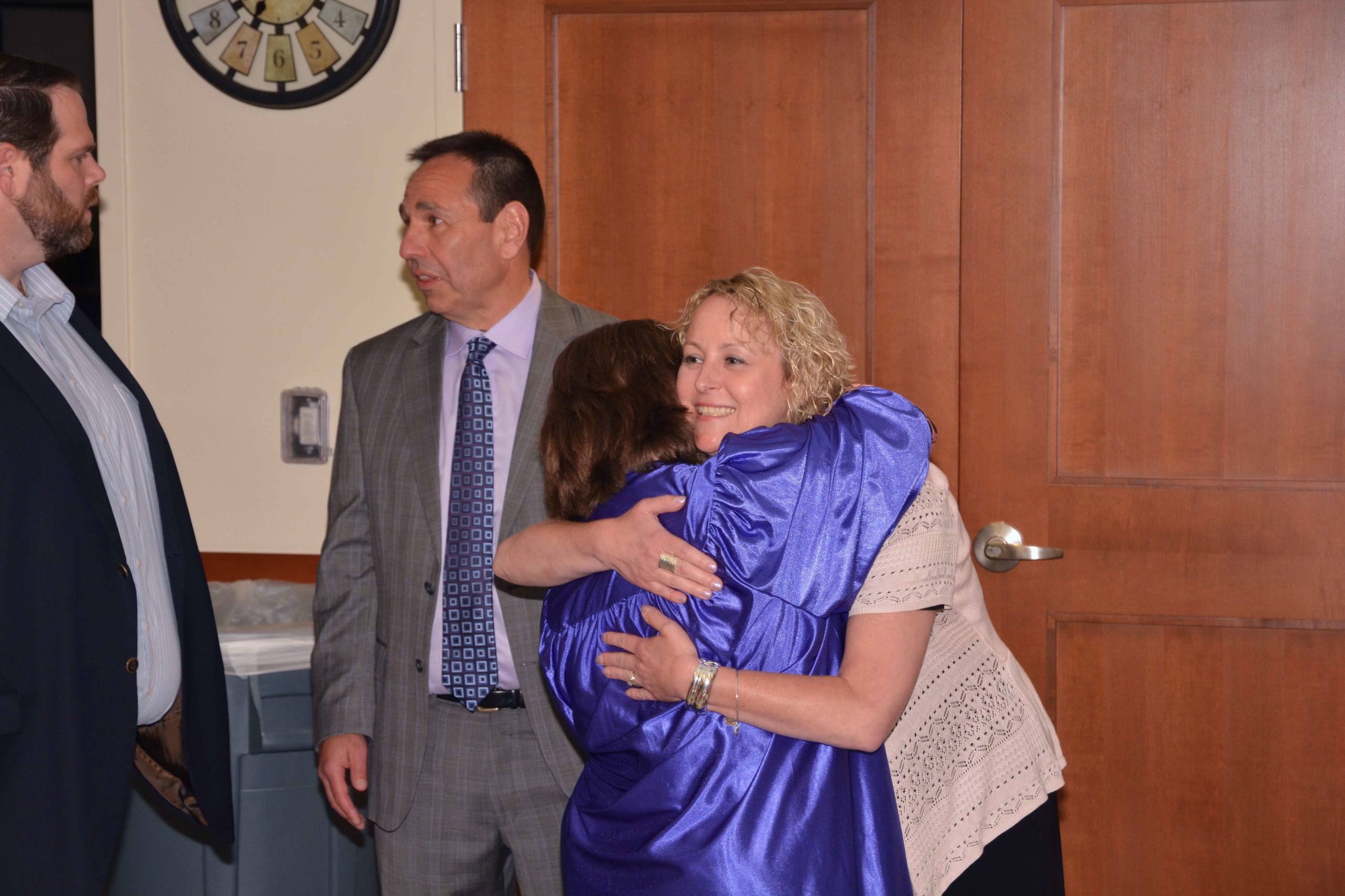 LEAD Graduation Ceremony graduate hugging Thrive staff member